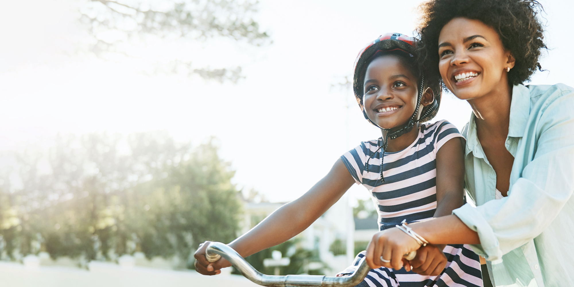 Girl and Mother Riding Bike